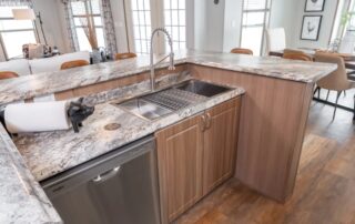 Kitchen island with a double stainless sink and dishwasher