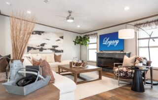 Living room with an electric fireplace wall and vaulted ceiling
