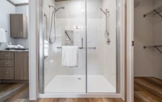 Walk-in shower with glass doors in the primary bath