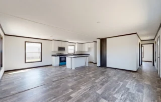 The connected rooms and bedroom hallway of a manufactured home reveal how its floor plan supports everyday family routines.
